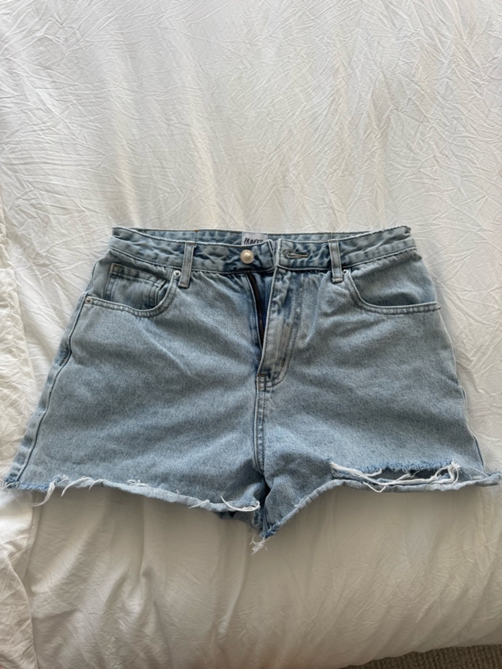 Princess Polly mid/high rise light denim shorts